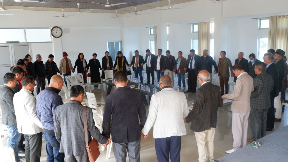 Praying In Solidarity: Representatives from all the churches in Naga areas and the Naga apex bodies representing all Naga cultural groups join hands in prayer during the meeting under the initiative of Forum for Naga Reconciliation (FNR) on January23, 2023.